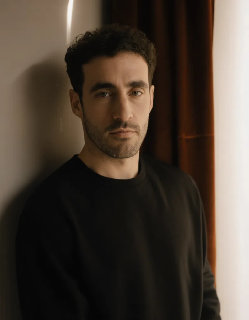 Portrait of Tomás Ferreira in the Velour studio, lit by daylight from one tall window
